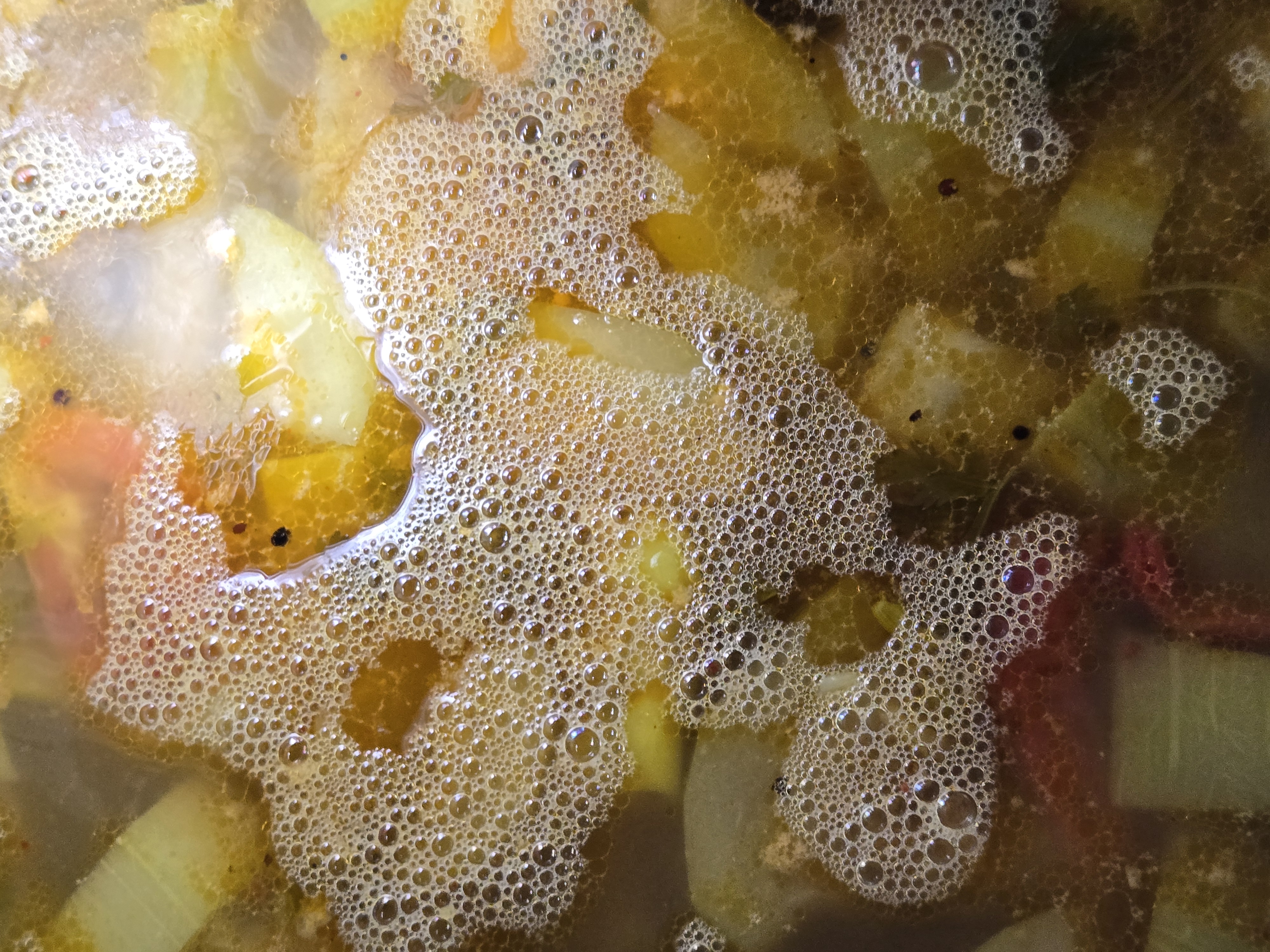 A curry simmering in the cooking pot